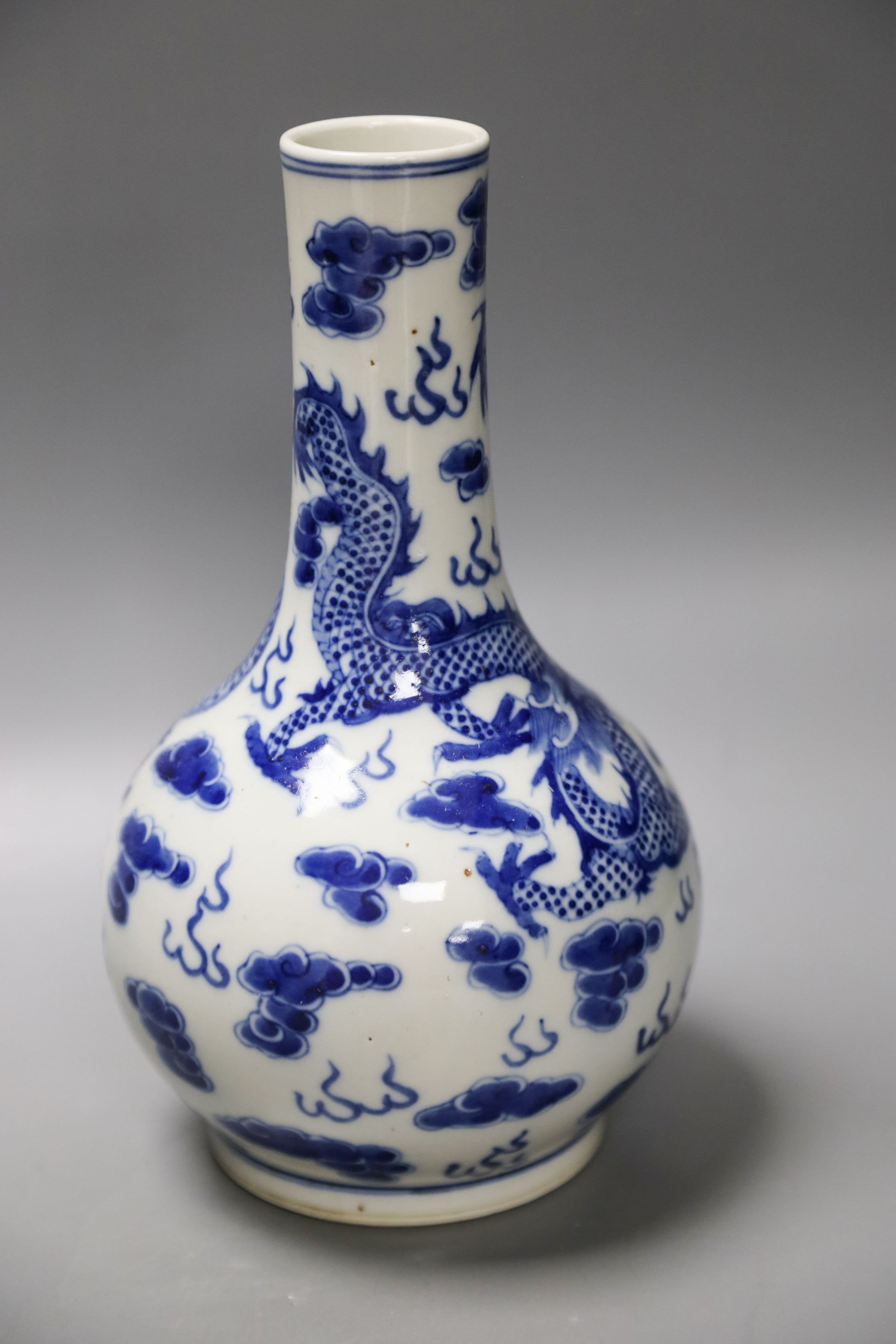 A Chinese blue and white dragon vase vase and Chinese green monochrome vase, mounted as a lamp 27cm